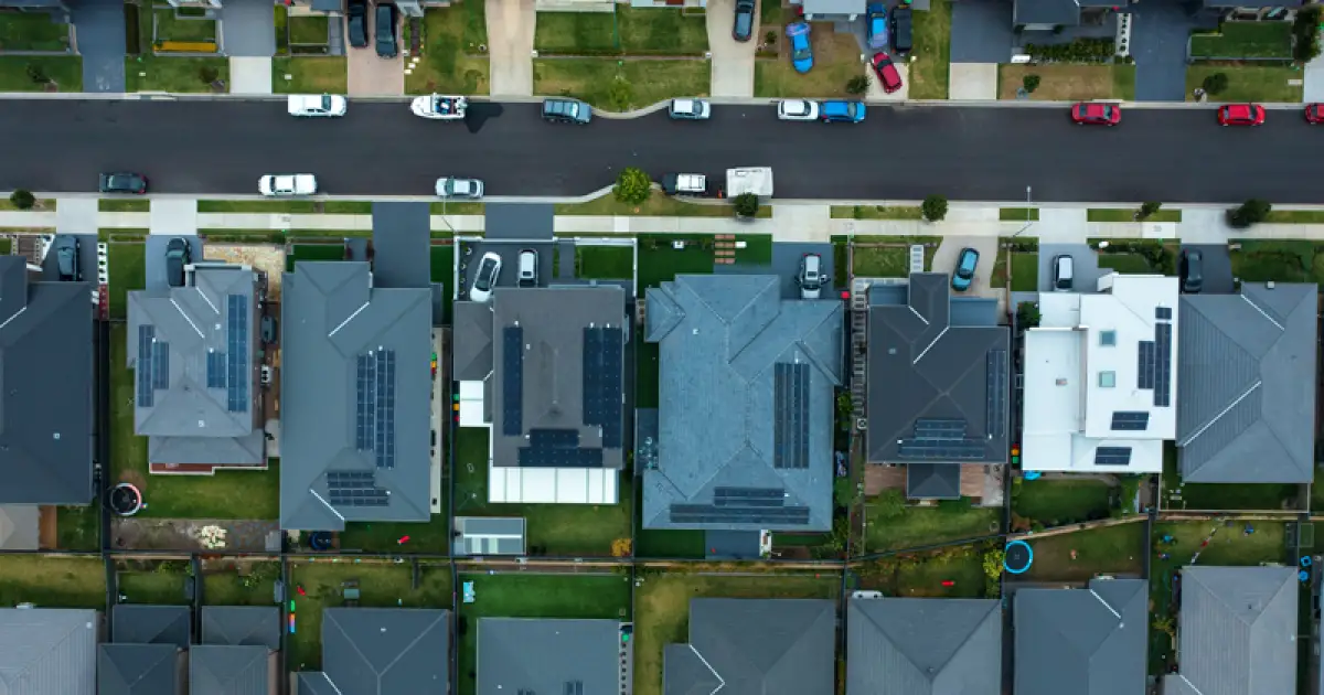 Neighbourhood of no trees, black roads, black roofs